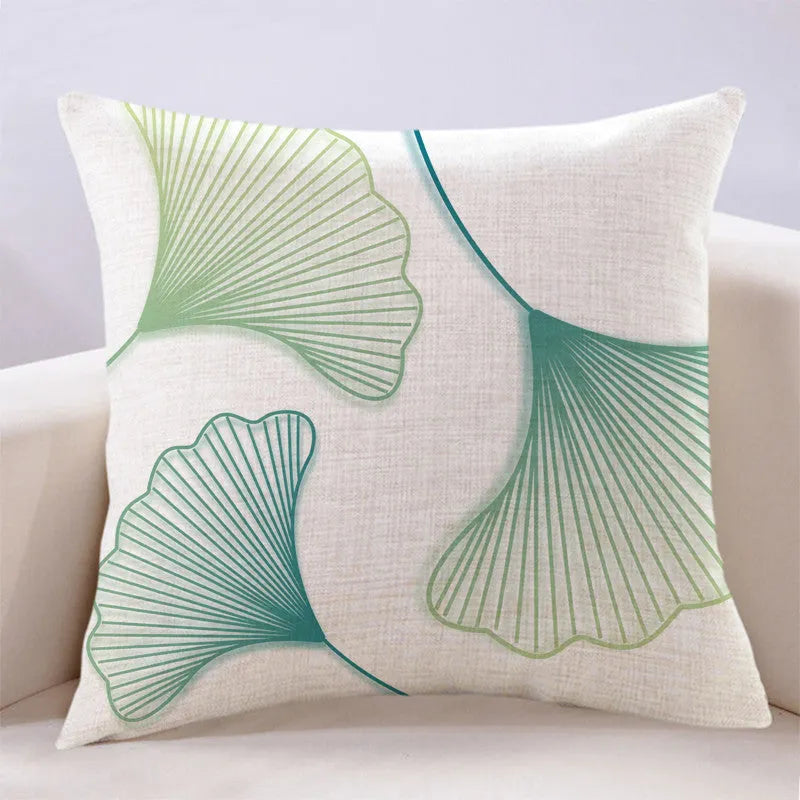 Ginkgo leaf printed square cushion cover on a sofa, available in multiple colours and sizes