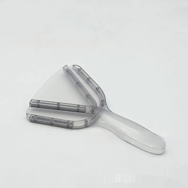 Red adjustable telescopic can and bottle opener with non-slip handle on a kitchen counter.