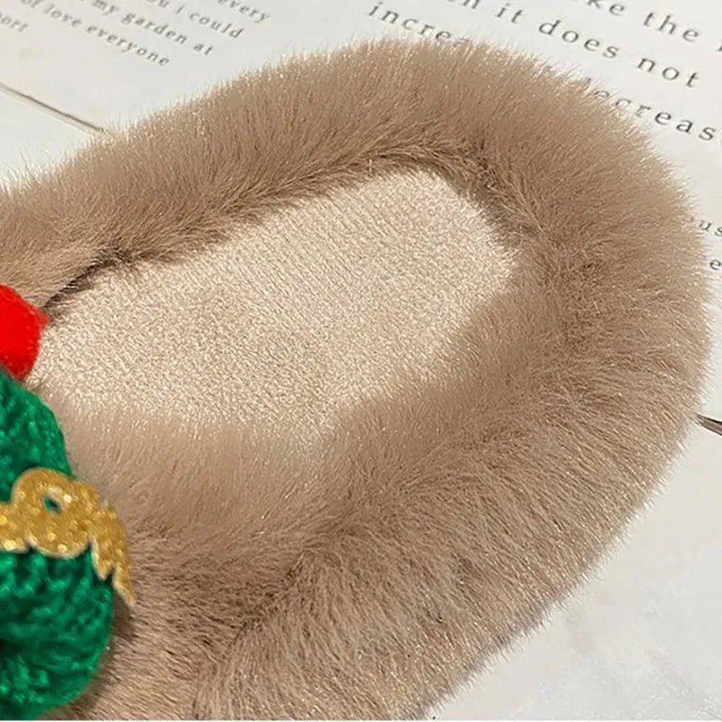 Women's black faux plush slippers designed like a Christmas hat with a rubber sole.