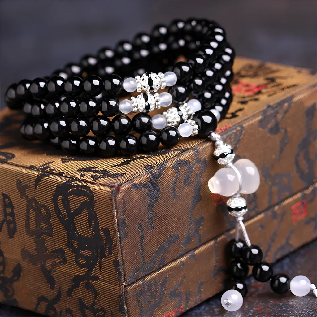 Natural black and red agate 108-bead bracelet with geometric shapes