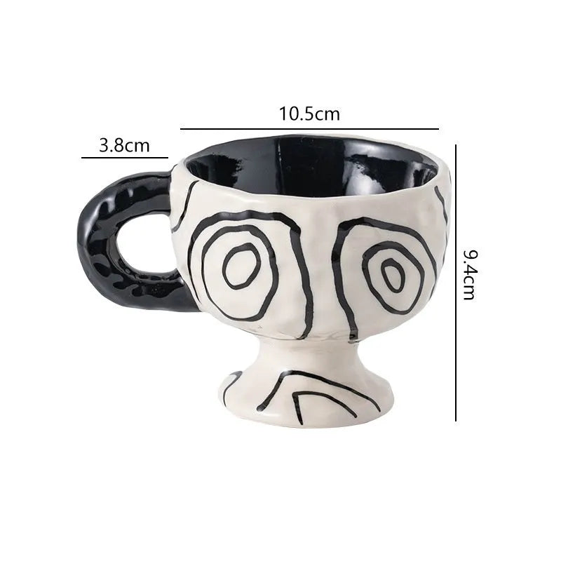 Hand-pinched irregular ceramic mug in a solid colour, showing its unique shape and modern design.