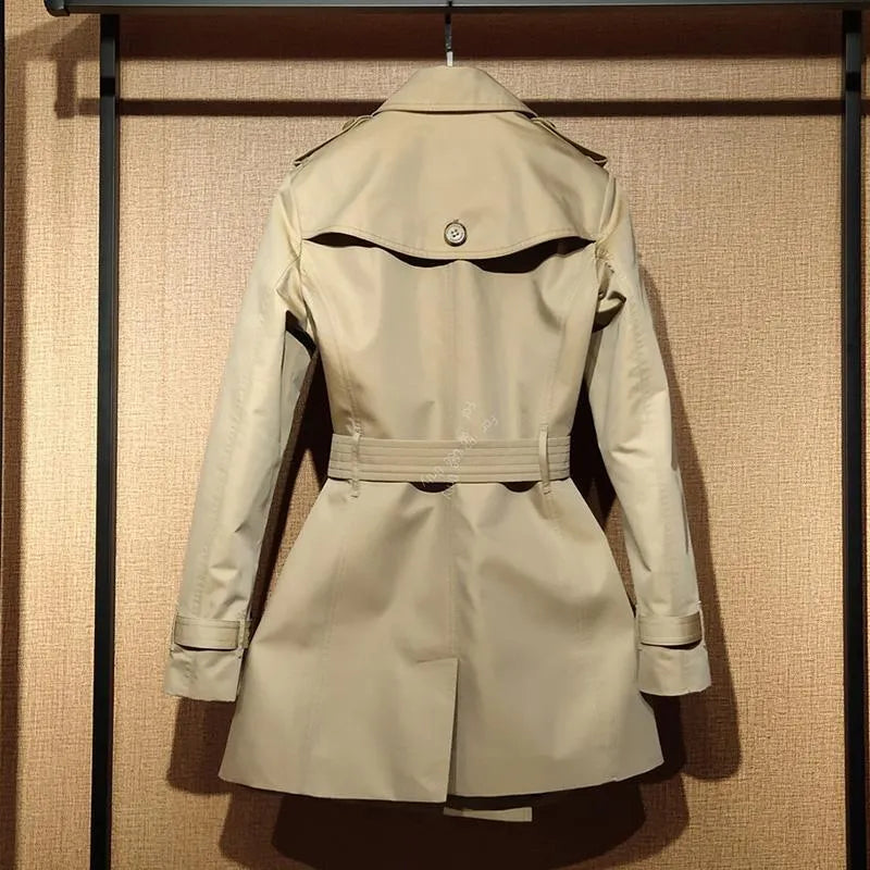 Khaki double-breasted trench coat for women with long flight sleeves, shown on a hanger.