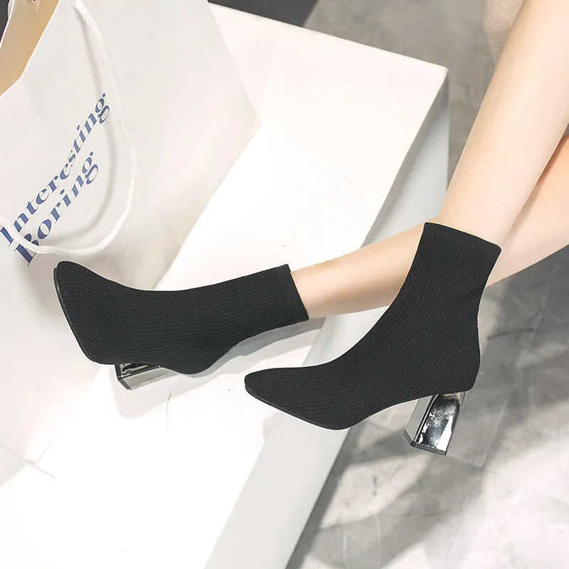 Women's stretch sock boots in black with short chunky heel and rubber sole