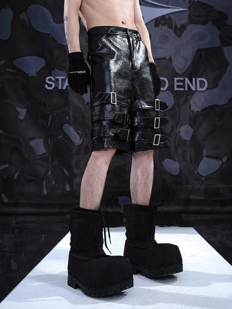 Black men's PU leather casual cropped shorts with a medium low waist on a mannequin.