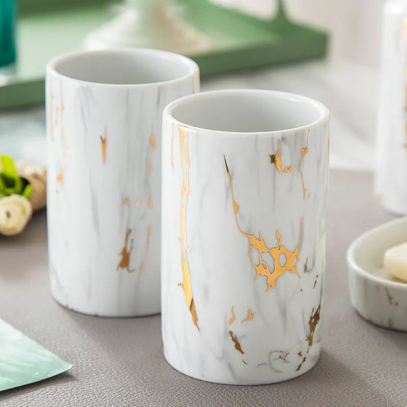White ceramic bathroom wash set with soap dish, drinking cups, and liquid dispenser in colour gift box