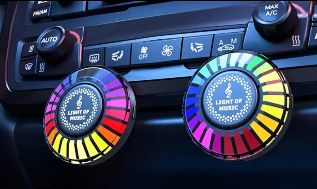 Car air vent-mounted RGB atmosphere light with aromatherapy diffuser in 3D pickup design.