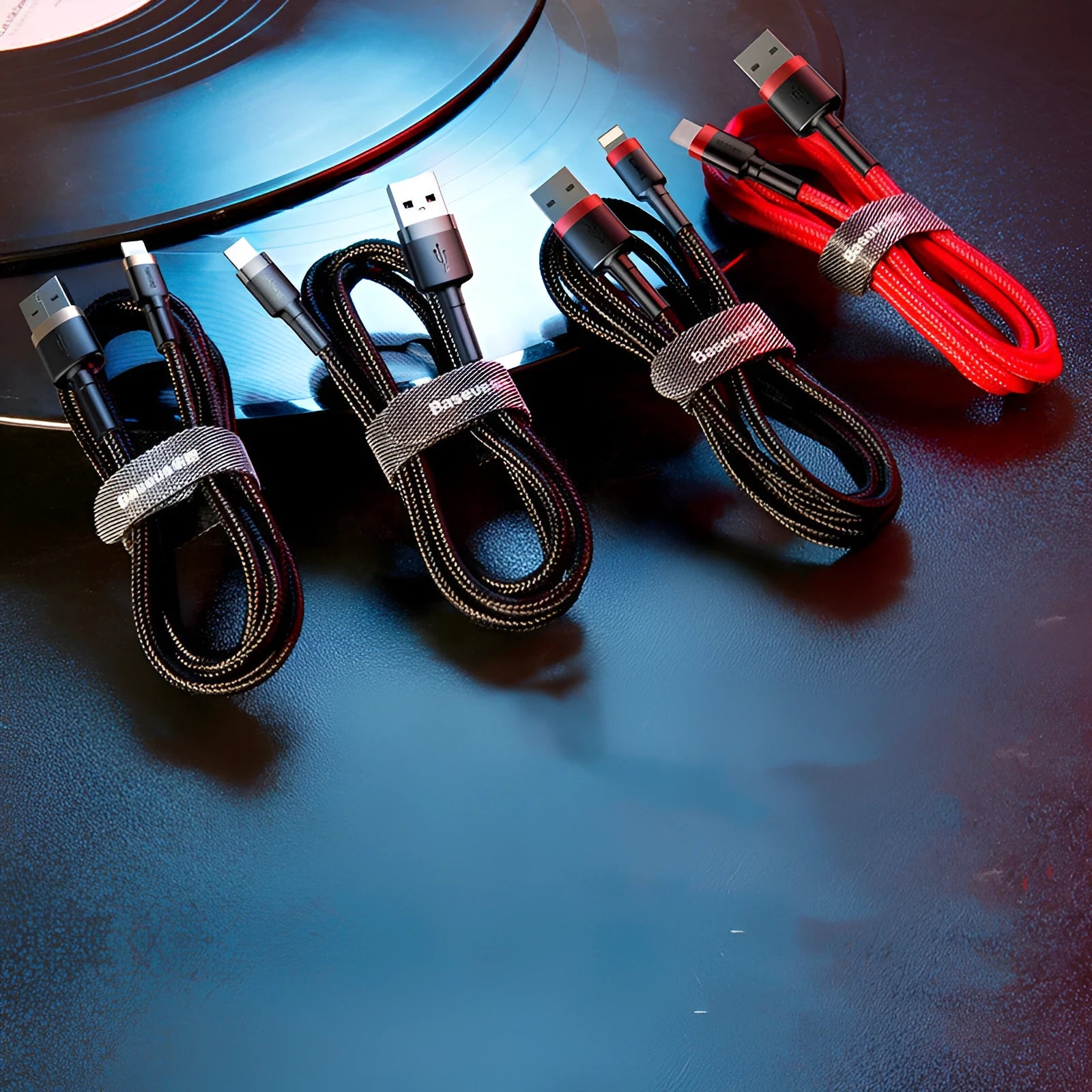 Red and deep space grey USB to Lightning charging cables in different lengths for iPhone.