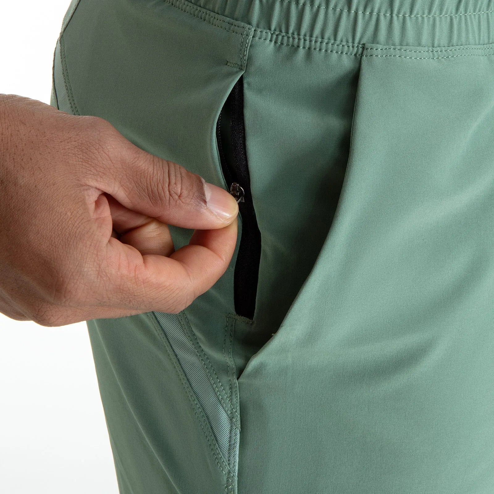 Men's black quick-drying sports shorts with mesh stitching detail on a grey background.