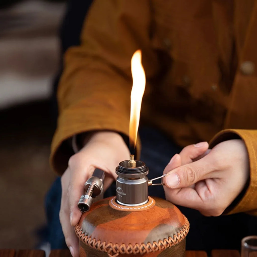 Portable gas cylinder light in silver, aluminum build, 120x50x50mm size, on outdoor background