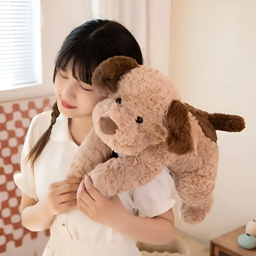 Lying dog plush toy in brown, white, and white and black, available in 35cm, 45cm, and 55cm heights.
