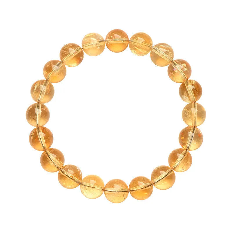 Natural yellow citrine Asestelle bracelet with geometric beads on a wrist.