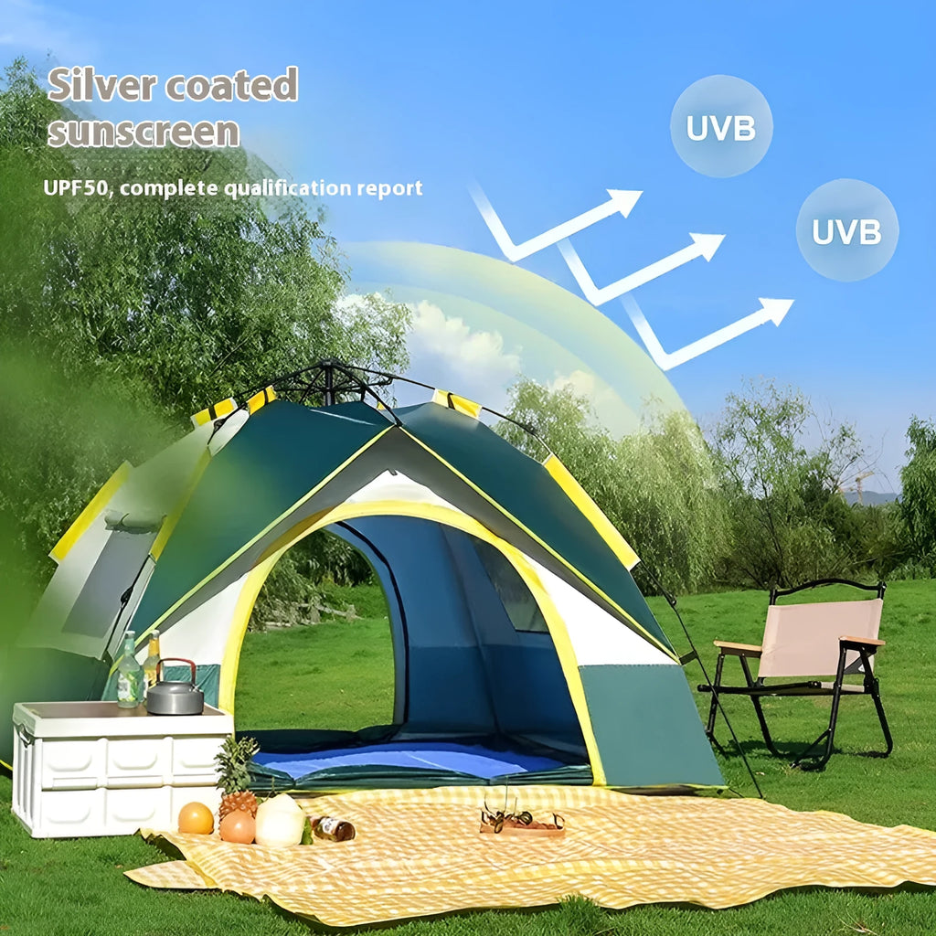 Dark green and silver automatic pop-up camping tent pitched in a field.