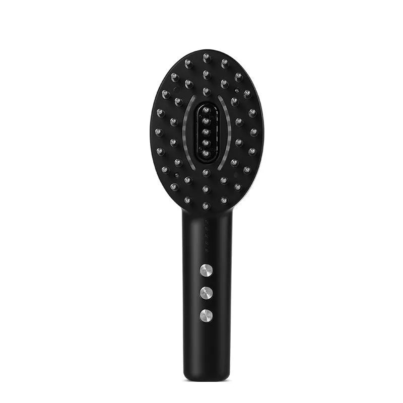 KD3802 Black scalp massage device with charging cable on a table.