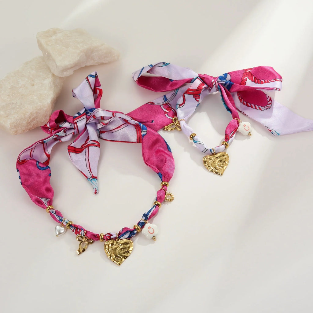Stainless steel necklace and bracelet set with geometric pendant featuring a colourful silk scarf insert