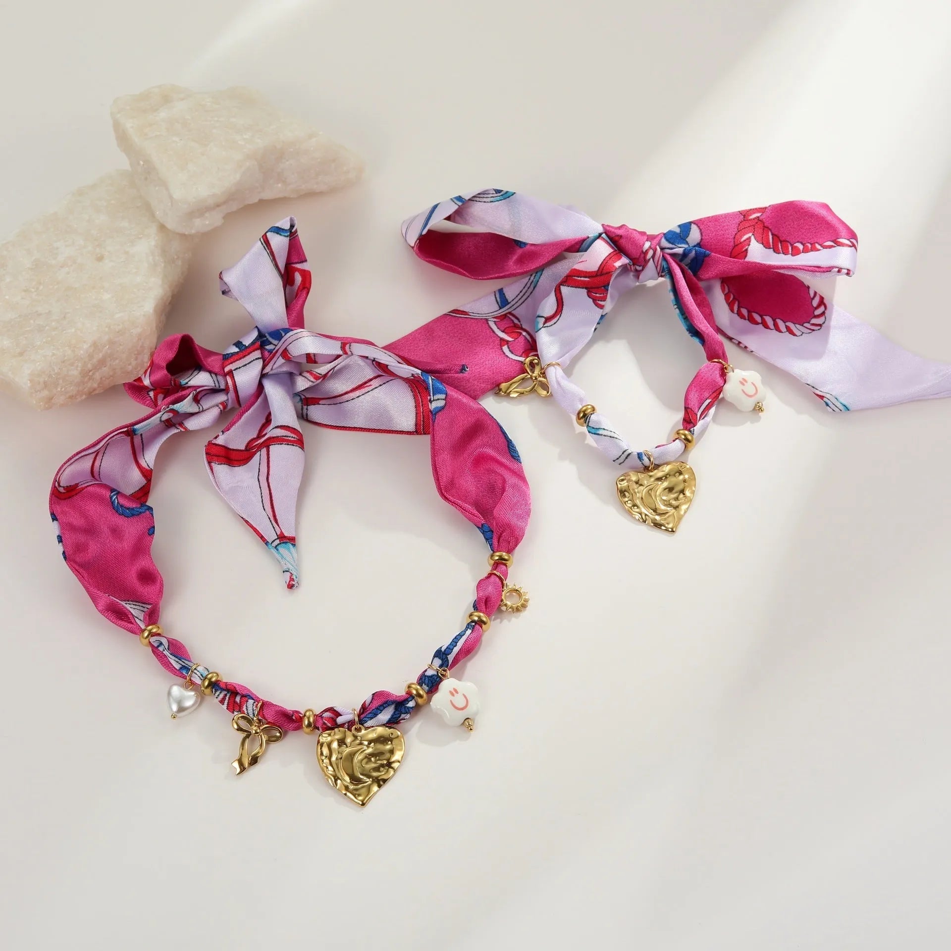Stainless steel necklace and bracelet set with geometric pendant featuring a colourful silk scarf insert