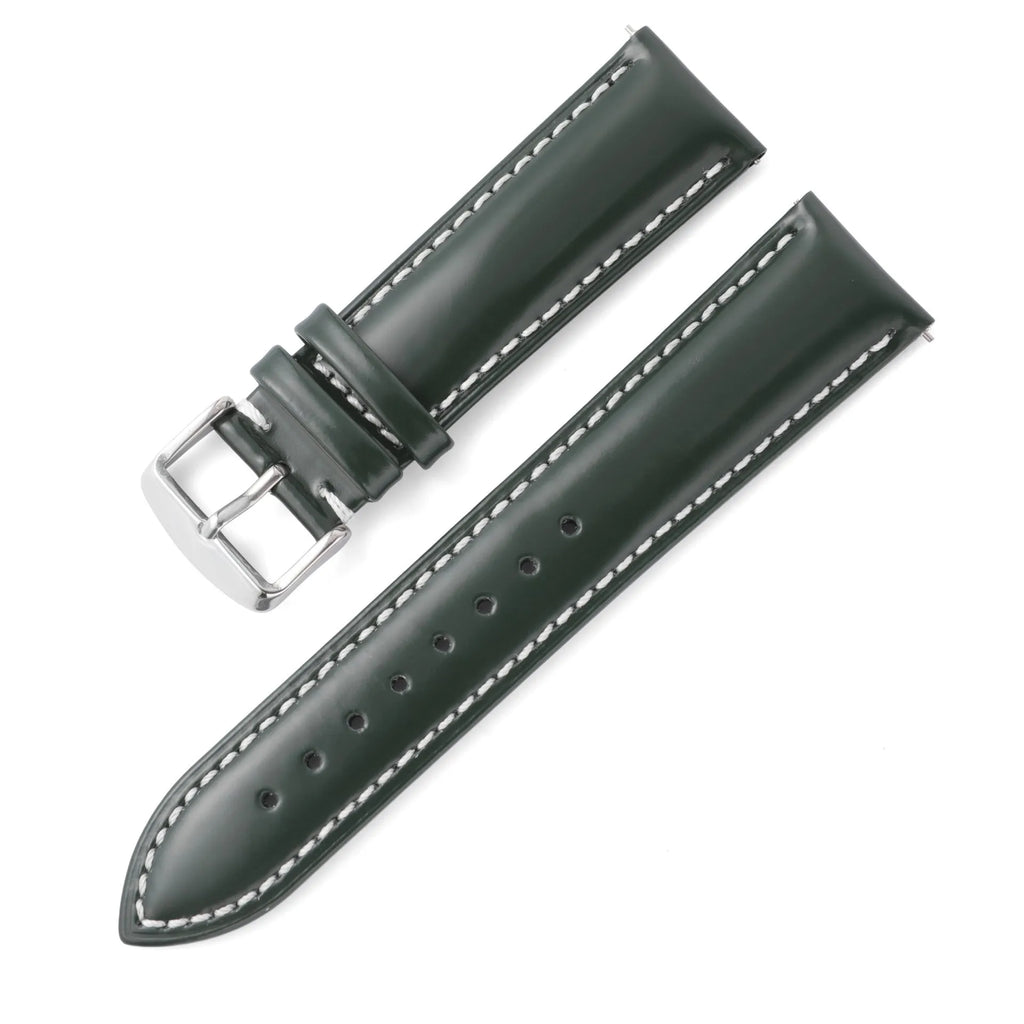 Quick release watch strap in black cowhide leather with white contrast stitching, shown detached from a watch.