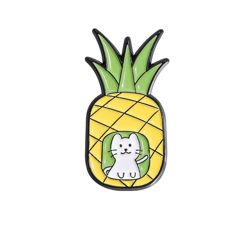 Colourful cartoon-style fruit metal brooch with a pin back on a denim jacket lapel.
