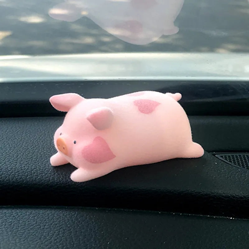 Cartoon pig character resin ornament for car dashboard decoration.