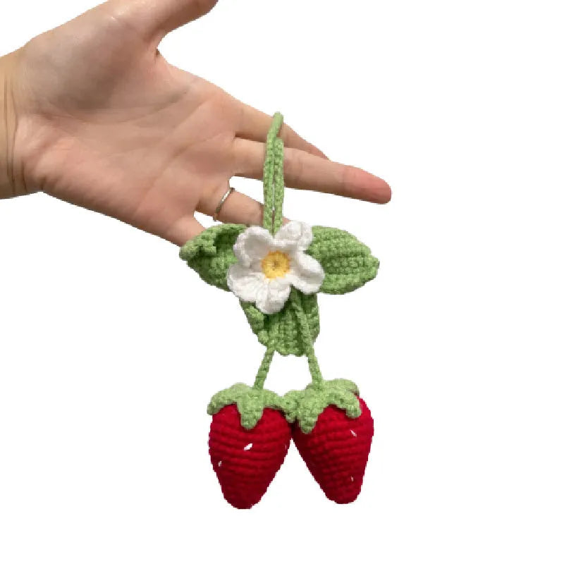 Handmade knitted strawberry shape car pendant made from cotton and hemp.