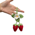 Handmade knitted strawberry shape car pendant made from cotton and hemp.