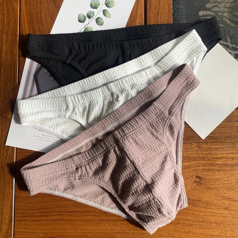 Men's solid colour cotton triangle underwear briefs showing mid waist design and available colour options