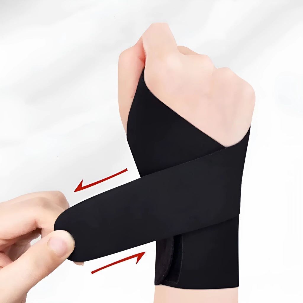 Adjustable black athletic wristguard worn on a wrist during activity.