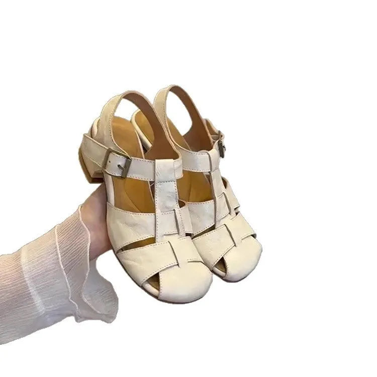 Women's Roman shoes in apricot colour with woven upper, buckle fastening, round toe, and low rubber sole