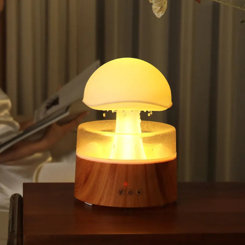White cloud-shaped humidifier with rainfall effect and colour changing night light