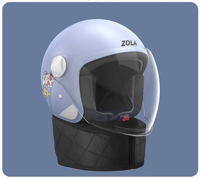 Blue winter cycling helmet with clear anti-fog visor and attached thermal scarf on handlebars.