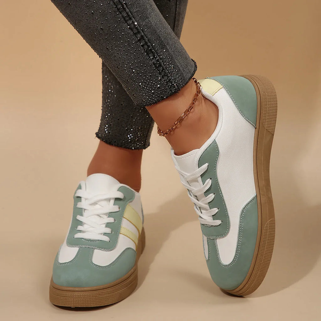 Women's green retro casual trainers with cross straps and round toe design on rubber sole