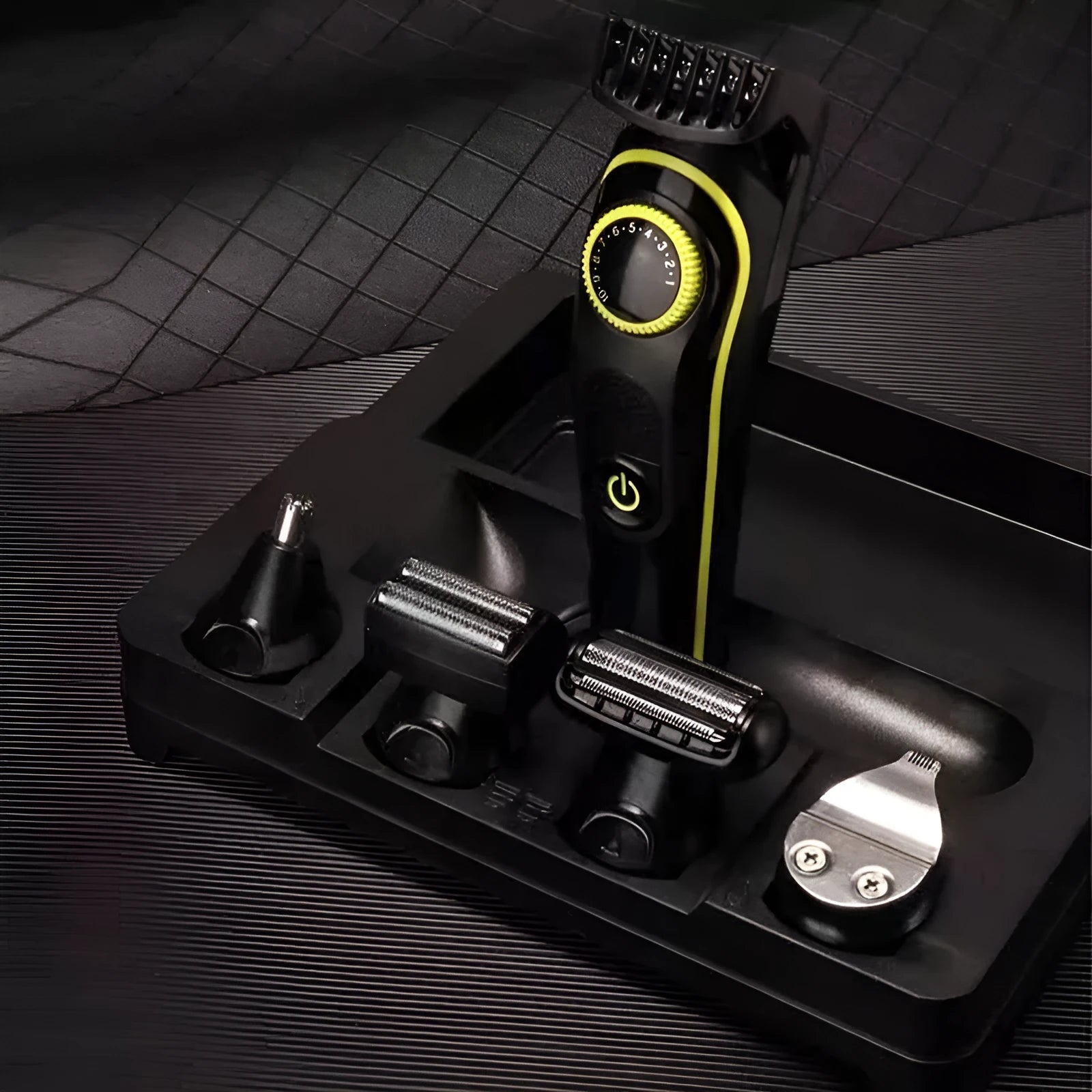 Black KM-696 rechargeable electric hair clipper set with USB cable and stainless steel blades.