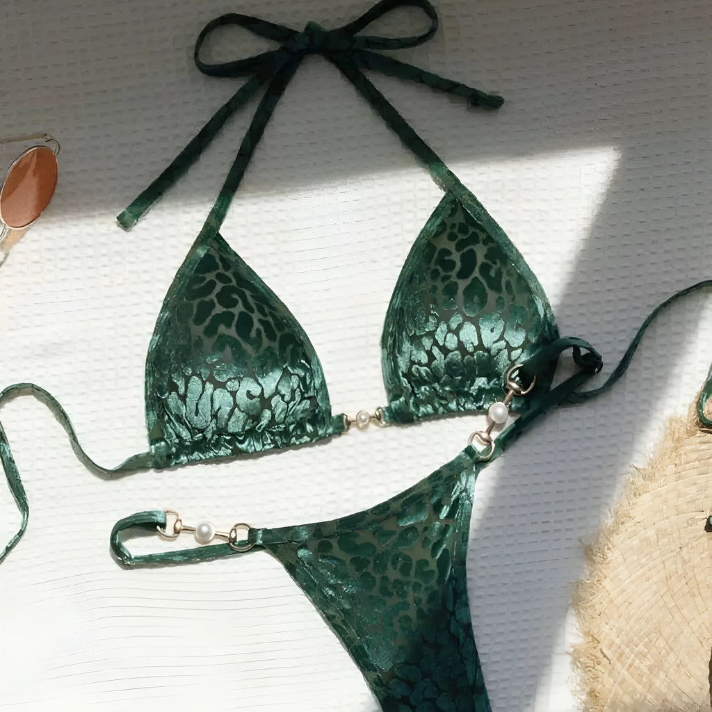 Women's blue leopard print T-shaped swimwear bikini set made from polyester and spandex fabric.