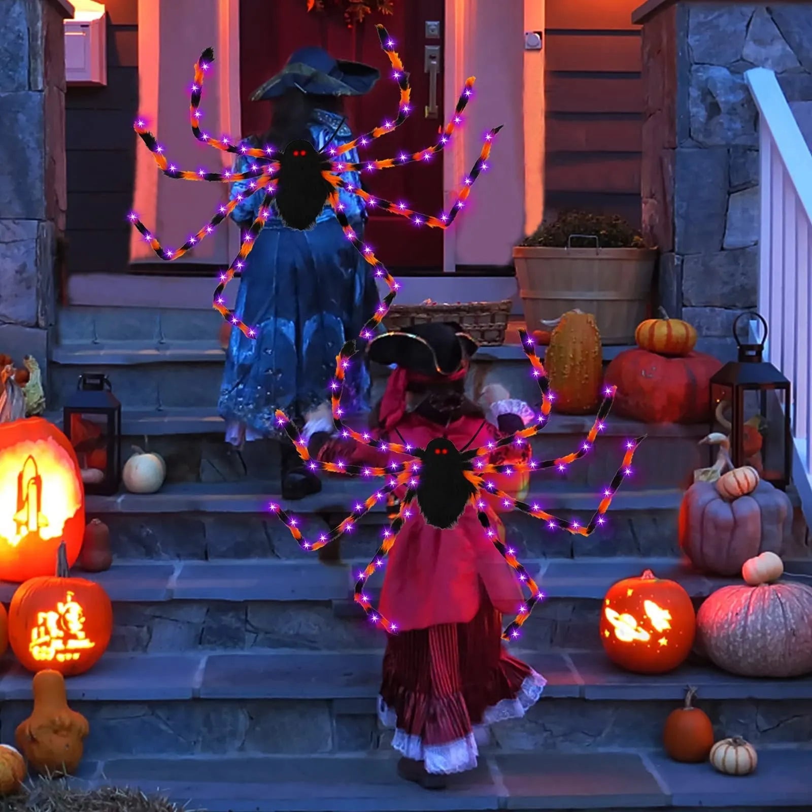 Orange plush Halloween spider backpack with purple LED lights lit up, showing the candy bag design.