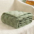 Geometric pattern polyester blanket in lake blue colour showing thickened texture