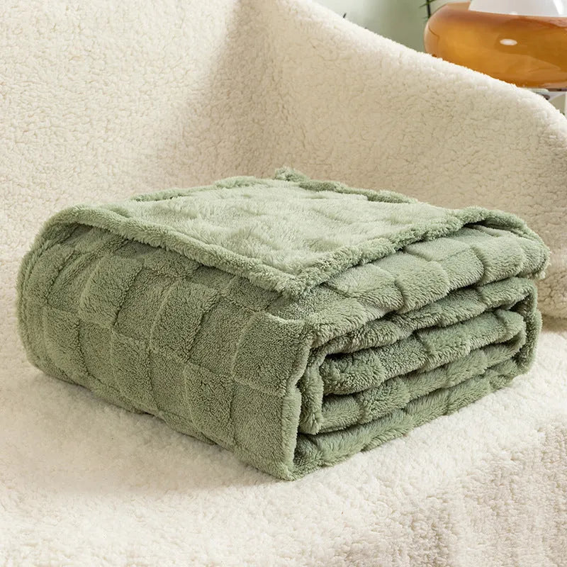 Geometric pattern polyester blanket in lake blue colour showing thickened texture