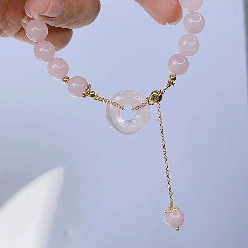 Pink crystal women's bracelet with peace buckle clasp and adjustable closure