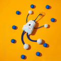 Blue telescopic elastic rope cat toy with plush and bell attachments on a white background.
