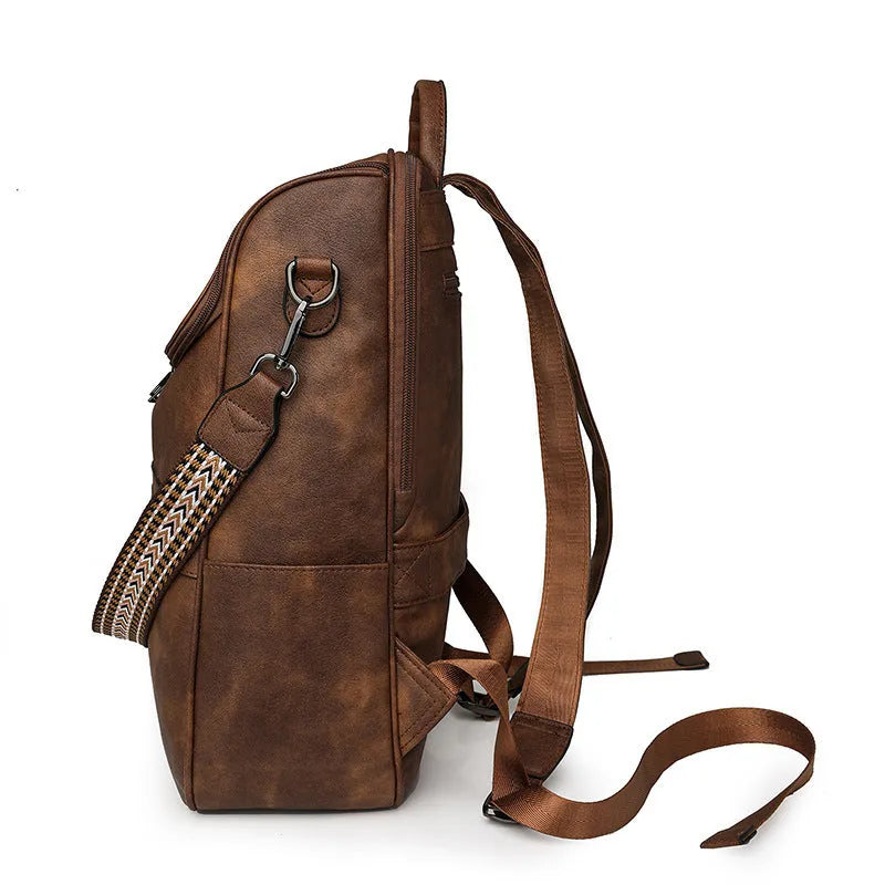 Solid-colour university backpack in PU leather with curved shoulder straps and minimalist stitching detail