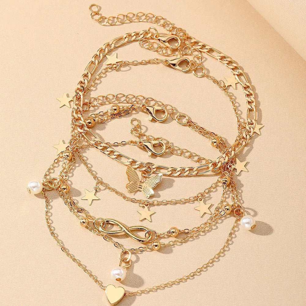 Butterfly pearl heart design four-piece alloy anklet set for women with multi-layer styling options