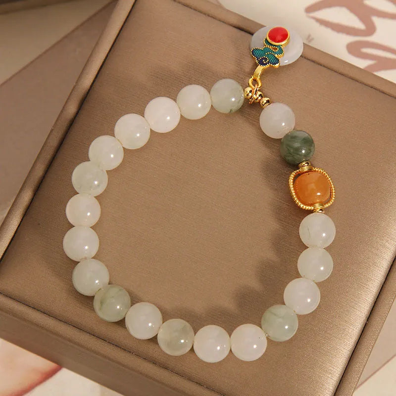 Women's ice jade bracelet with pearl accents and carved jade buckle clasp