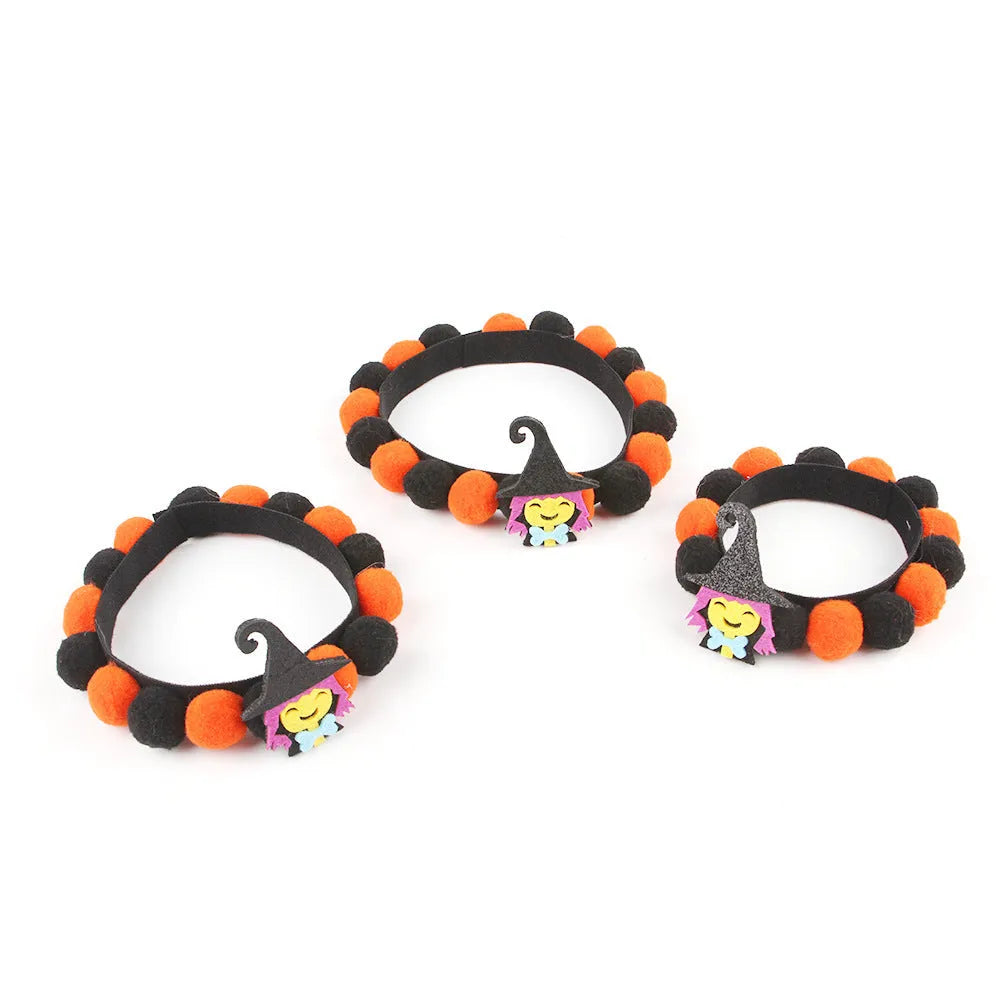 Halloween pet fur ball collar in pumpkin design with adjustable sizing