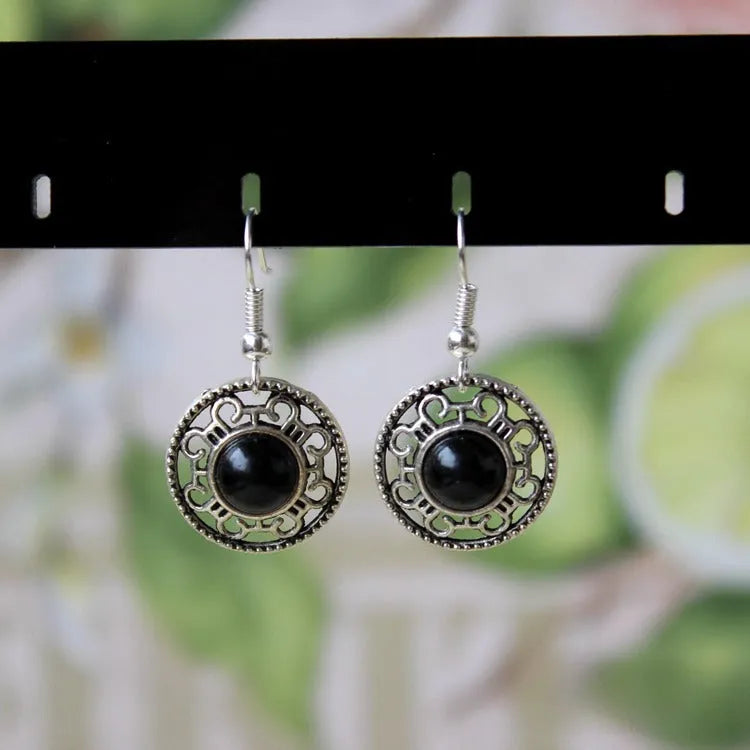 Geometric Miao silver ethnic earrings with turquoise flower disk in black, blue, or red.