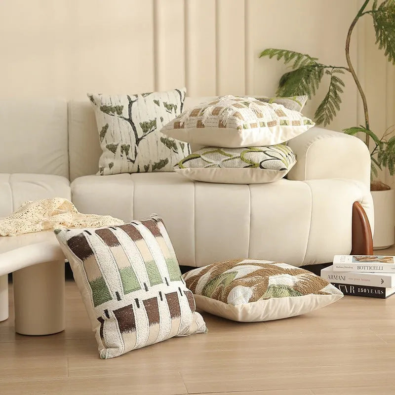 Square jacquard pillow cover with retro botanical pattern, shown in one of eight colour options.