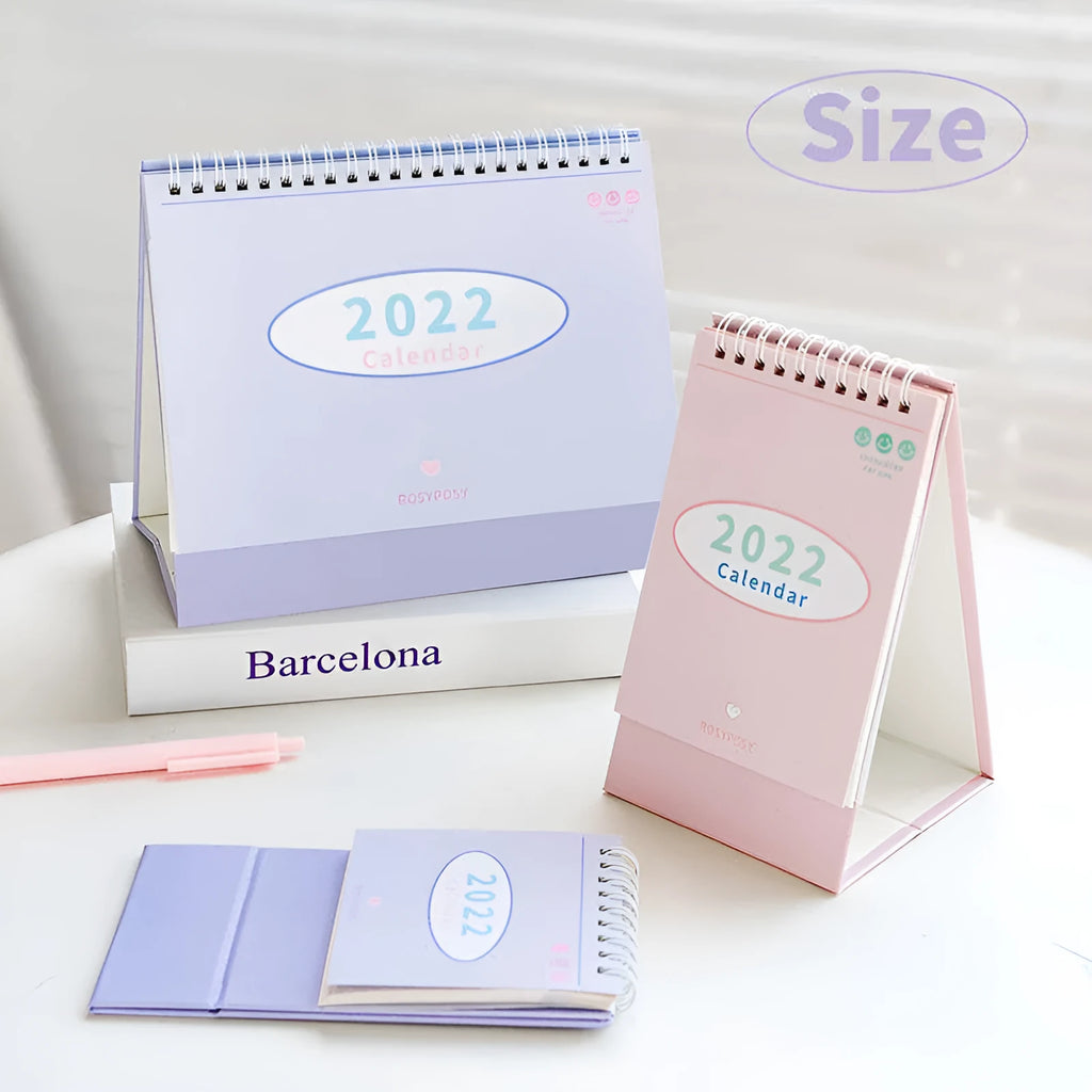Cream coil-bound desk calendar for 2022, paper, 210g, Regular size 100x100x172mm, on a desk