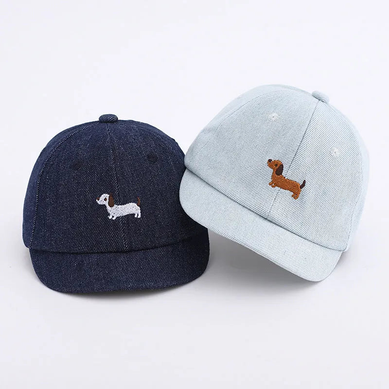 Babies denim puppy baseball cap with short brim and dome crown in light blue, dark blue, or black, 48cm size