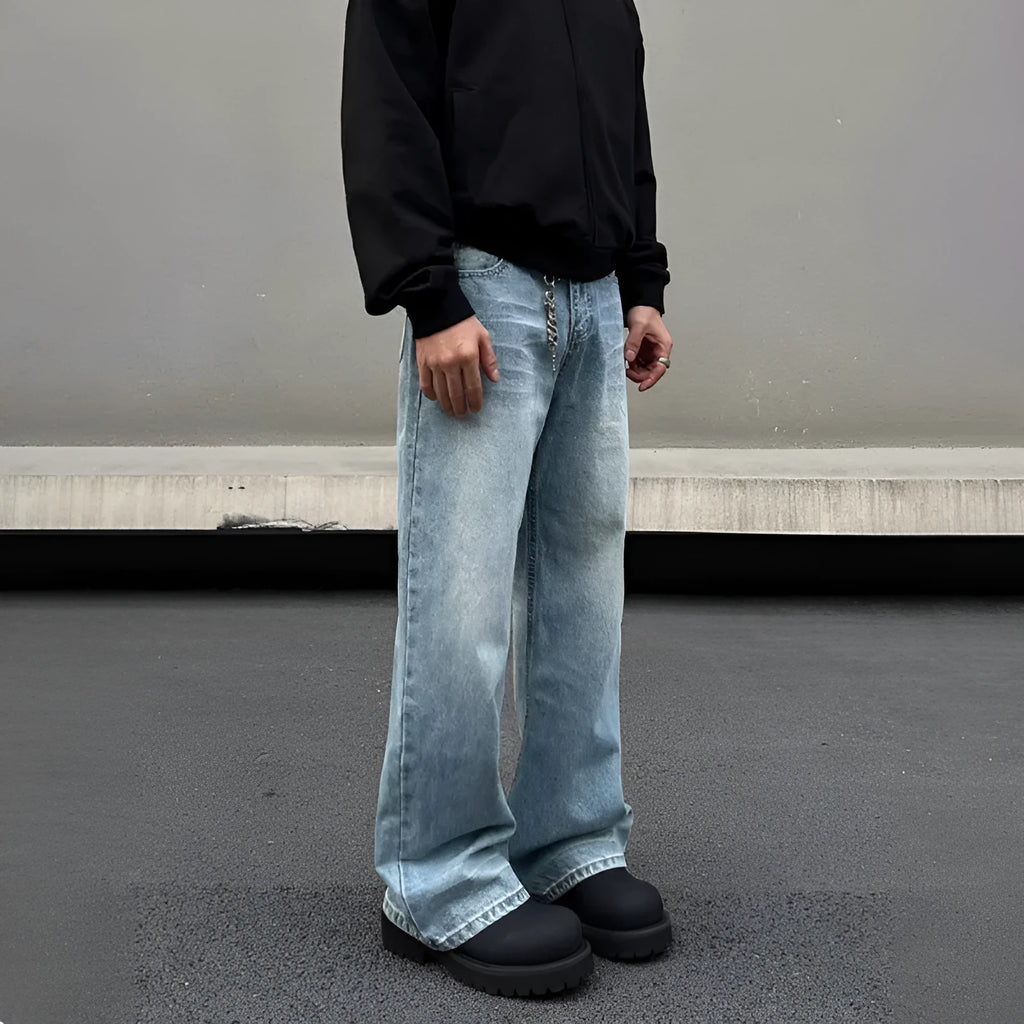 Men's blue straight leg jeans with whisker washing and visible stitching detail