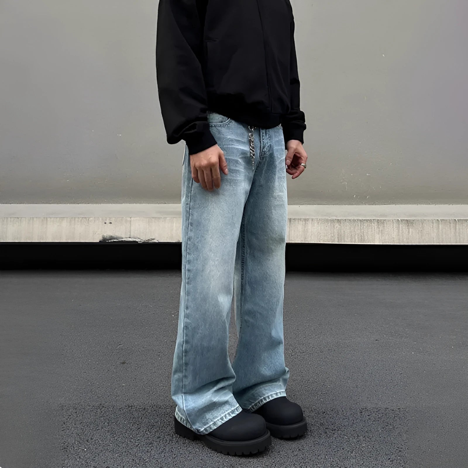 Men's blue straight leg jeans with whisker washing and visible stitching detail