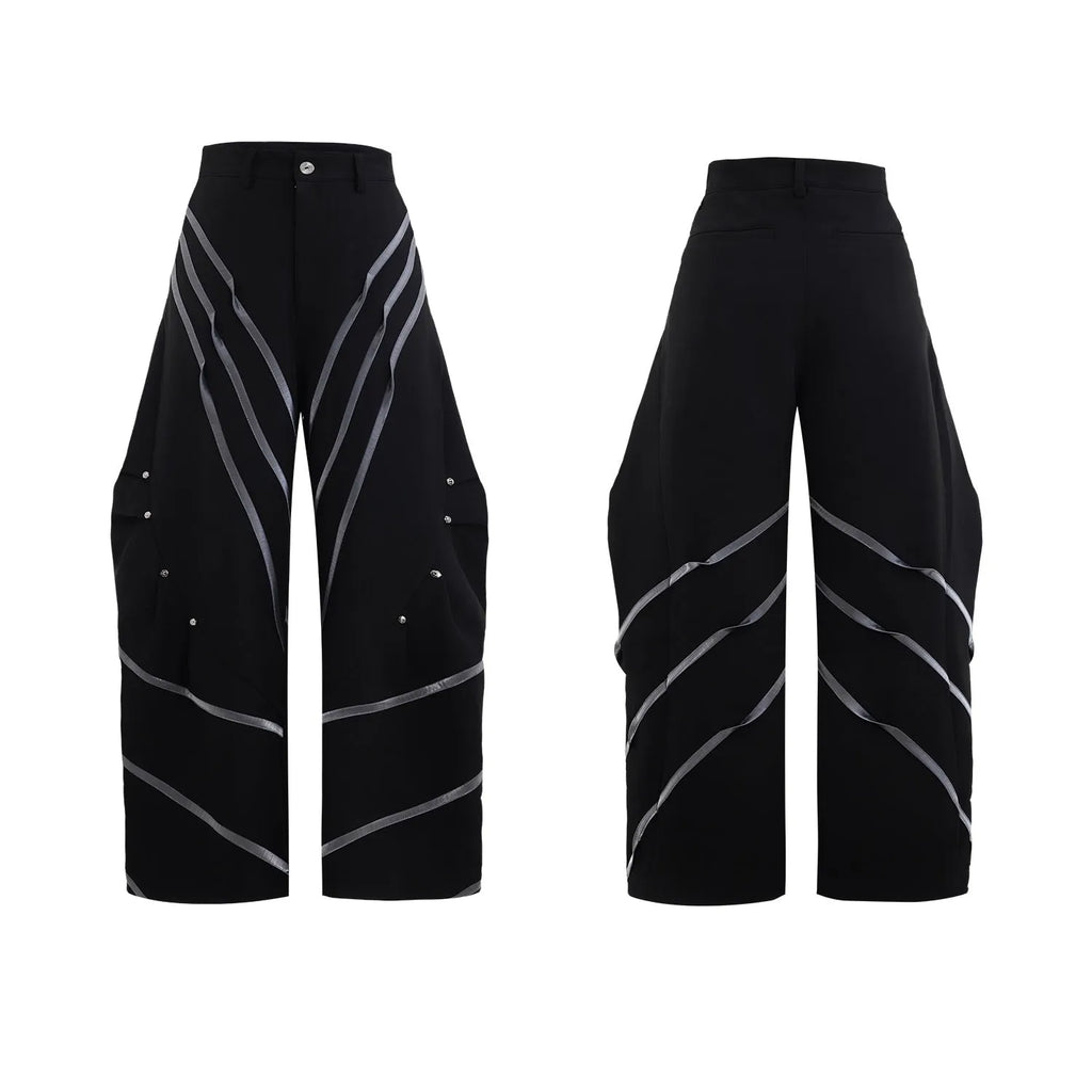 Men's black trousers with deconstructed three-dimensional cutting and metal rivets on the pleats