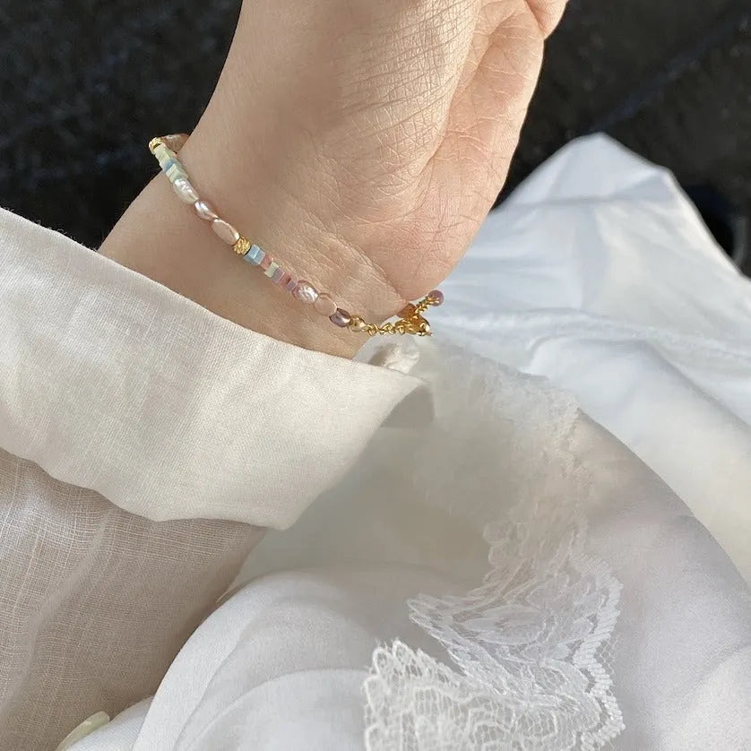 Natural pearl bracelet and necklace set with small irregular pearls and 14K gilded purple silver finish.