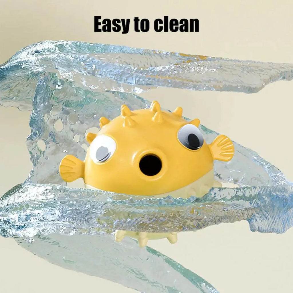 Yellow vinyl fish-shaped dog chew toy with textured surface and squeaker inside.